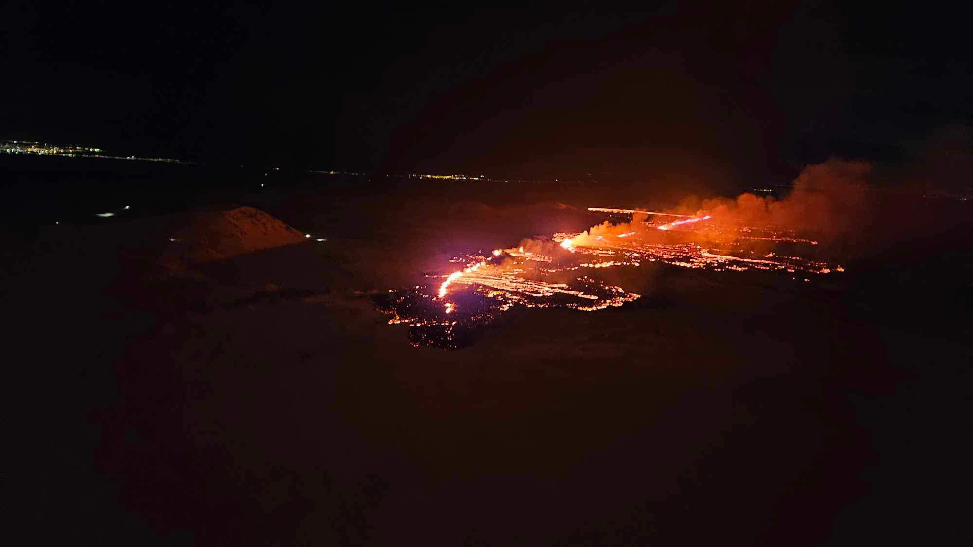 The 2023 fissure eruption at night, lava glowing across the dark lava field